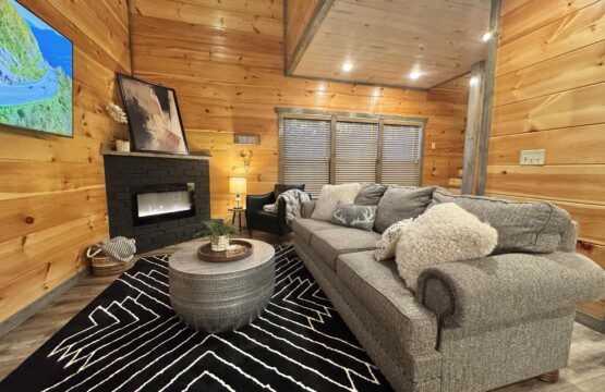 Family room with fireplace and large TV, Sevierville, TN vacation rental